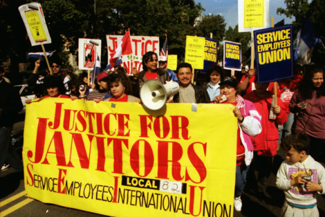 March for Immigrant Rights. Crowd of people with signs that demand "Justice for Janitors"