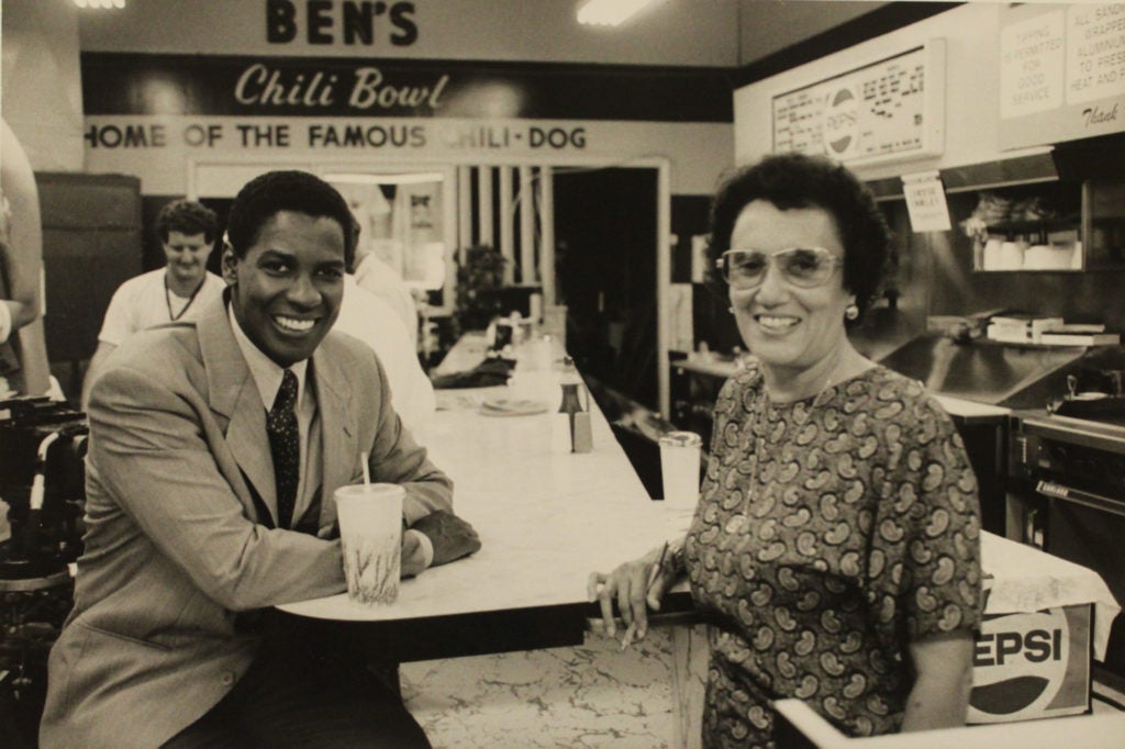 Old photo of Denzel Washington and Mrs. Ali at Ben's Chili Bowl, in U Street