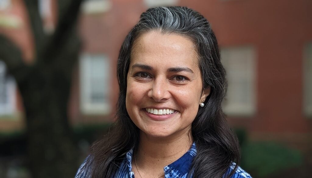 Headshot of Anjelika in a blue shirt